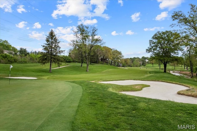 2244 Kehrsglen Ct, Clarkson Valley, MO 63005 - surrounding community featuring view of golf course, a lawn, a putting green, and view of wooded area
