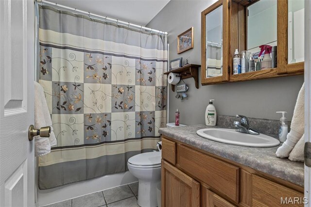13219 Apache Point Dr, Saint Genevieve, MO 63670 - bathroom with tile patterned floors, toilet, vanity, and shower / tub combo with curtain