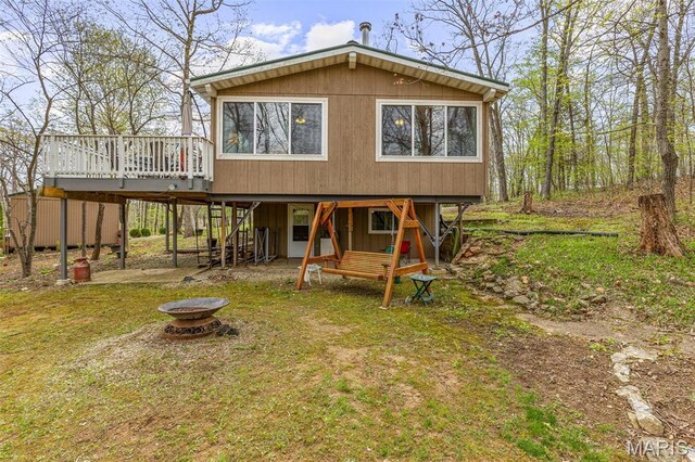 13219 Apache Point Dr, Saint Genevieve, MO 63670 - back of property with a fire pit, a wooden deck, and stairway