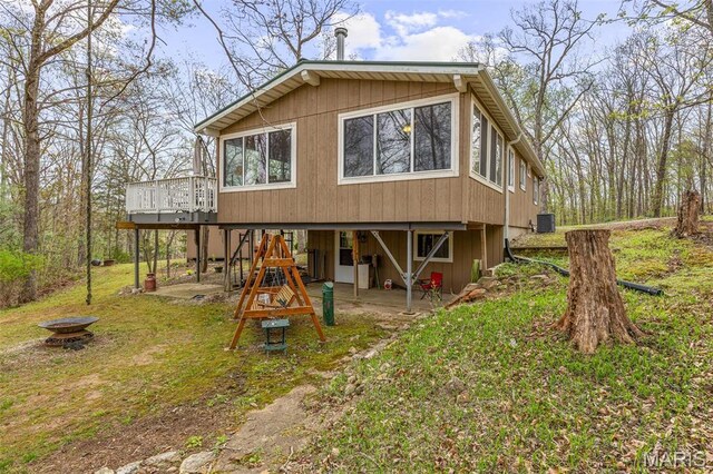 13219 Apache Point Dr, Saint Genevieve, MO 63670 - rear view of property with an outdoor fire pit, a deck, a patio area, and central air condition unit