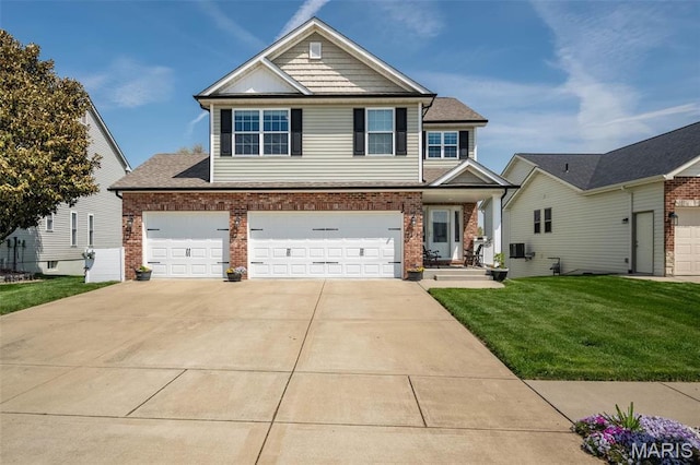 1338 Orchard Lakes Cir, Belleville, IL 62220 - view of front facade featuring brick siding, a front lawn, driveway, and a garage