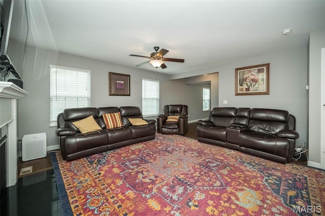 1338 Orchard Lakes Cir, Belleville, IL 62220 - living room with ceiling fan, baseboards, a fireplace, and carpet