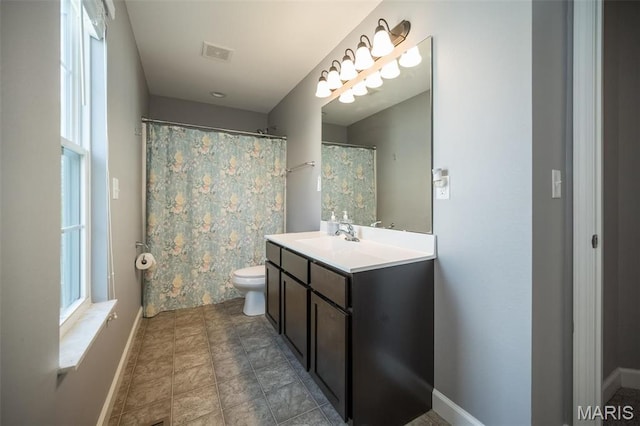 1338 Orchard Lakes Cir, Belleville, IL 62220 - bathroom with baseboards, vanity, and toilet