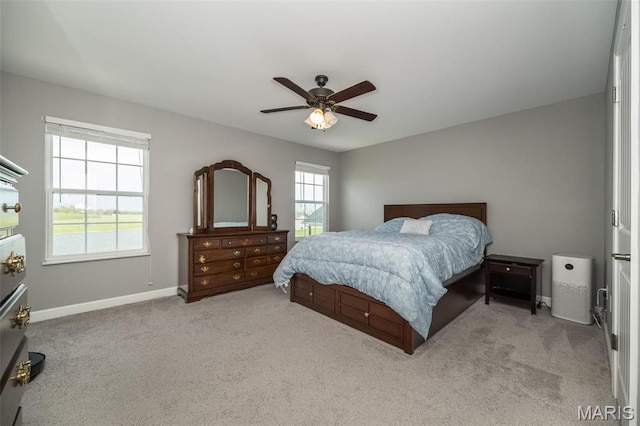 1338 Orchard Lakes Cir, Belleville, IL 62220 - bedroom with light colored carpet, baseboards, and a ceiling fan