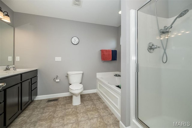 1338 Orchard Lakes Cir, Belleville, IL 62220 - bathroom featuring baseboards, a shower stall, vanity, a garden tub, and toilet