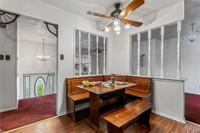 11 Heather Ct, Crystal City, MO 63019 - dining room with dark wood-style floors, a ceiling fan, a chandelier, and baseboards