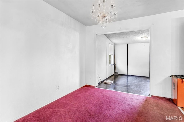 11 Heather Ct, Crystal City, MO 63019 - spare room with a chandelier, carpet, and baseboards