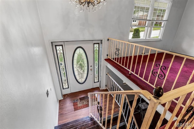 11 Heather Ct, Crystal City, MO 63019 - foyer entrance featuring wood finished floors, a chandelier, stairway, and a high ceiling