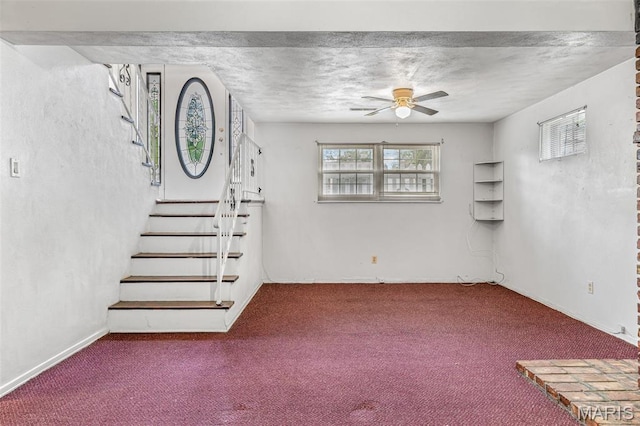 11 Heather Ct, Crystal City, MO 63019 - unfurnished living room with ceiling fan, carpet flooring, and stairway