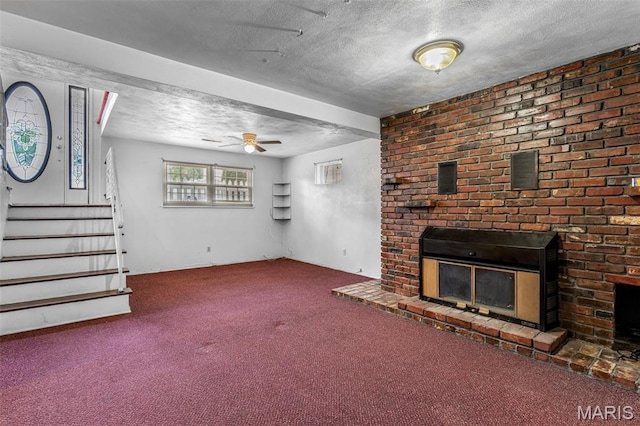 11 Heather Ct, Crystal City, MO 63019 - unfurnished living room featuring carpet floors, a textured ceiling, a brick fireplace, stairway, and a ceiling fan