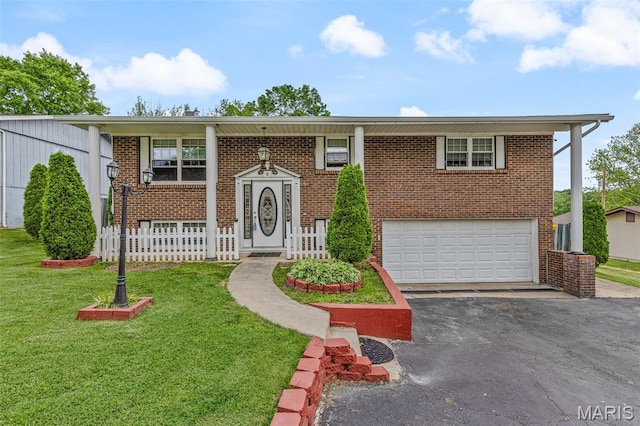11 Heather Ct, Crystal City, MO 63019 - raised ranch with a garage, driveway, a front lawn, brick siding, and covered porch