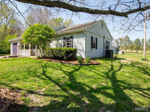 3701 Brandt Rd, Fults, IL 62298 - view of home's exterior featuring an attached garage, a yard, and central AC unit