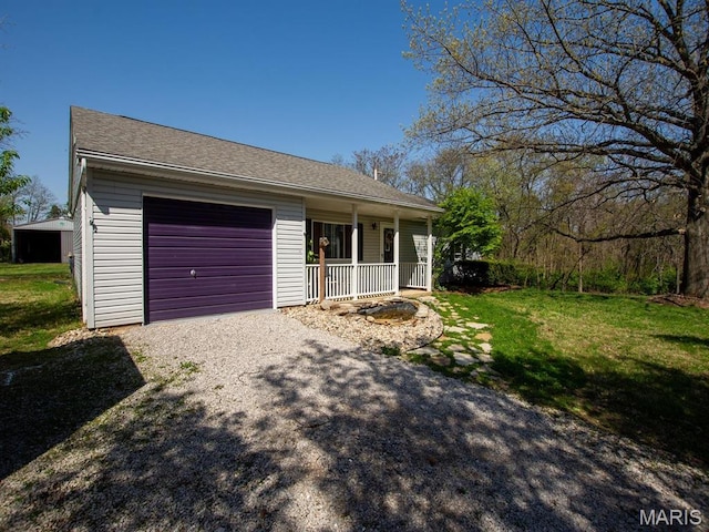 3701 Brandt Rd, Fults, IL 62298 - view of front of house featuring covered porch, an attached garage, gravel driveway, and a front yard