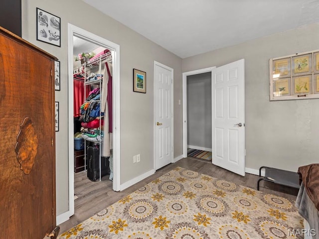 3701 Brandt Rd, Fults, IL 62298 - bedroom with a spacious closet, wood finished floors, baseboards, and a closet