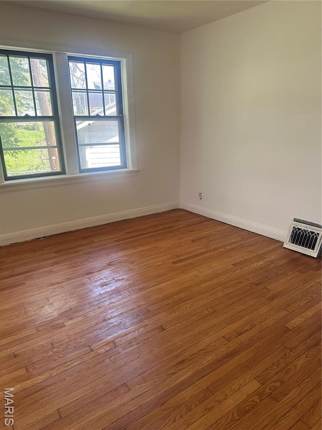 3460 Oakdale Ave, Saint Louis, MO 63121 - unfurnished room with baseboards and wood finished floors