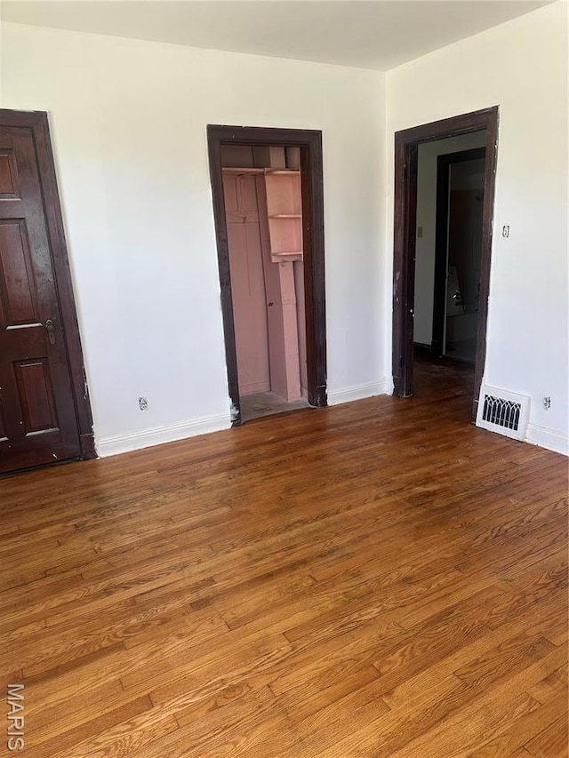 3460 Oakdale Ave, Saint Louis, MO 63121 - unfurnished room featuring wood finished floors and baseboards