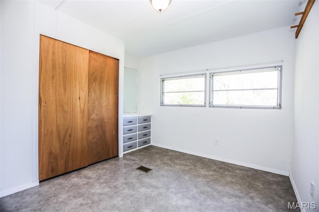 5507 Sassafras Ln, High Ridge, MO 63049 - unfurnished bedroom featuring a closet, baseboards, and carpet floors