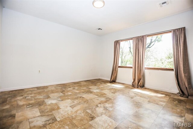 5507 Sassafras Ln, High Ridge, MO 63049 - spare room with stone finish flooring and baseboards