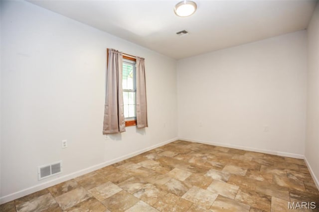 5507 Sassafras Ln, High Ridge, MO 63049 - empty room with stone finish flooring and baseboards