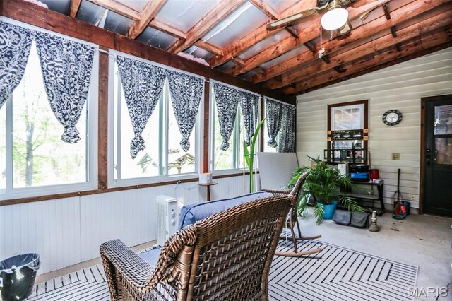 5507 Sassafras Ln, High Ridge, MO 63049 - sunroom featuring a ceiling fan, wood walls, and concrete floors