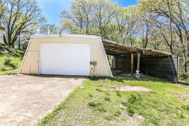 5507 Sassafras Ln, High Ridge, MO 63049 - garage with a detached garage and driveway