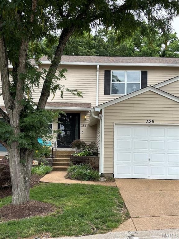 156 Cascade Terrace Dr, Ballwin, MO 63021 - townhome / multi-family property featuring a garage and driveway