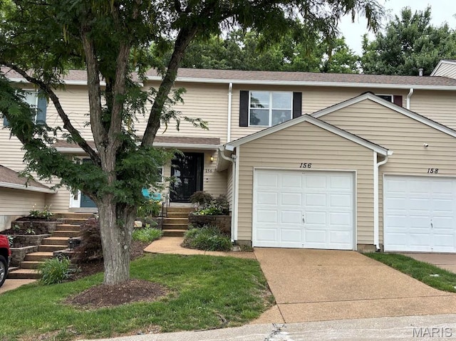 156 Cascade Terrace Dr, Ballwin, MO 63021 - townhome / multi-family property with an attached garage and driveway
