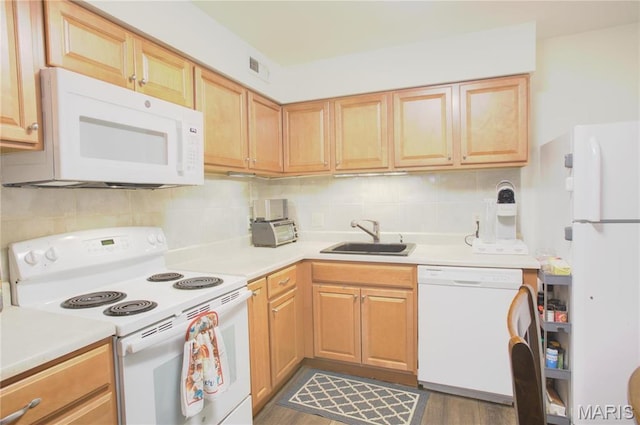 1912 Marine Terrace Dr Unit C, Saint Louis, MO 63146 - kitchen with white appliances, a sink, light countertops, tasteful backsplash, and wood finished floors