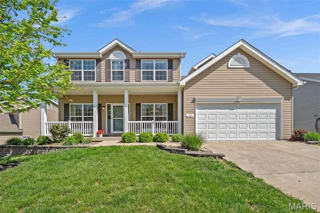 133 Hidden Bluffs Dr, Lake St Louis, MO 63367 - colonial-style house featuring concrete driveway, an attached garage, covered porch, and a front lawn