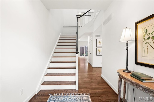 139 N Central Ave Unit P, Saint Louis, MO 63105 - staircase featuring a high ceiling and wood finished floors