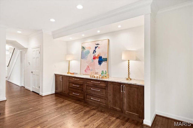 139 N Central Ave Unit P, Saint Louis, MO 63105 - bar with crown molding, dark wood-style flooring, recessed lighting, and stairs