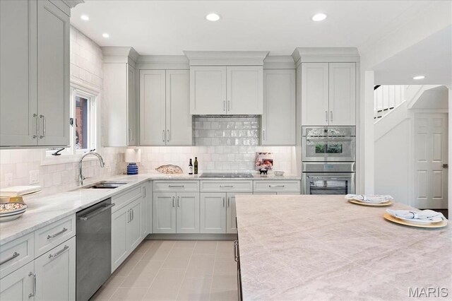 139 N Central Ave Unit P, Saint Louis, MO 63105 - kitchen featuring stainless steel appliances, recessed lighting, and backsplash