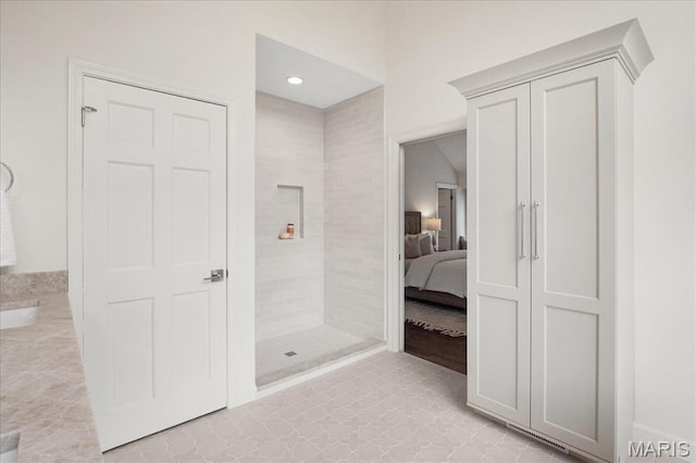 139 N Central Ave Unit P, Saint Louis, MO 63105 - ensuite bathroom featuring tiled shower