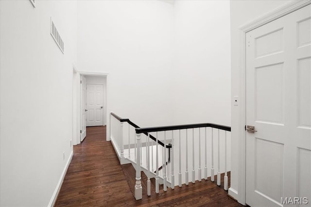 139 N Central Ave Unit P, Saint Louis, MO 63105 - hall featuring an upstairs landing and wood finished floors