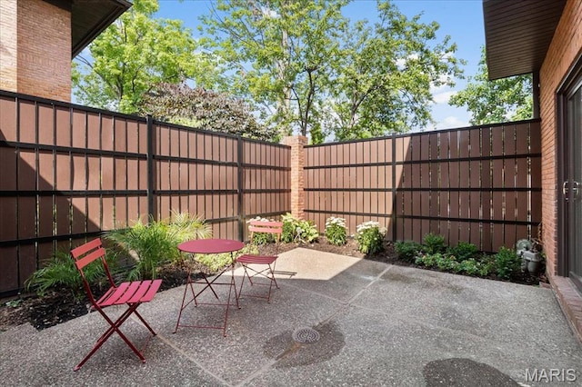 139 N Central Ave Unit P, Saint Louis, MO 63105 - fenced backyard featuring a patio