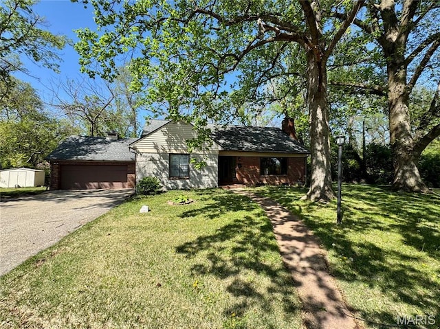 ranch-style house with brick siding, an attached garage, driveway, and a chimney