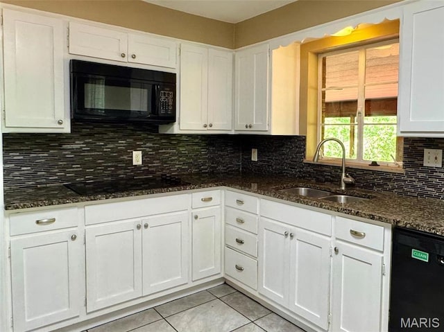 kitchen with black appliances, a sink, white cabinetry, and light tile patterned floors