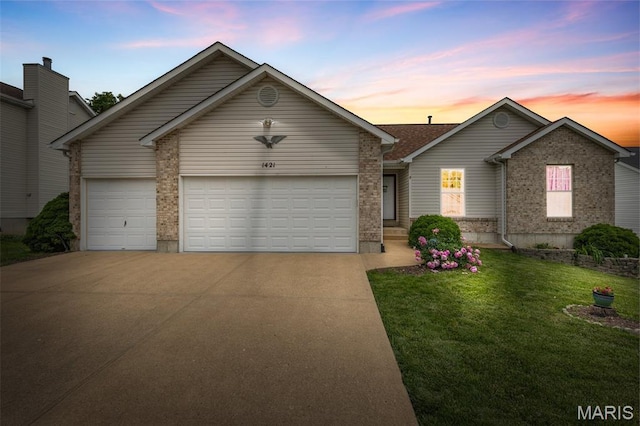 1421 N Woods Dr, Festus, MO 63028 - view of front of property featuring concrete driveway, brick siding, a lawn, and an attached garage