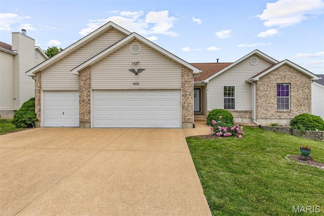1421 N Woods Dr, Festus, MO 63028 - view of front of house featuring driveway, an attached garage, brick siding, and a front lawn