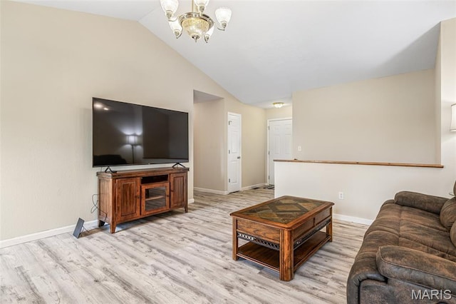 1421 N Woods Dr, Festus, MO 63028 - living area featuring light wood-style floors, baseboards, a chandelier, and lofted ceiling