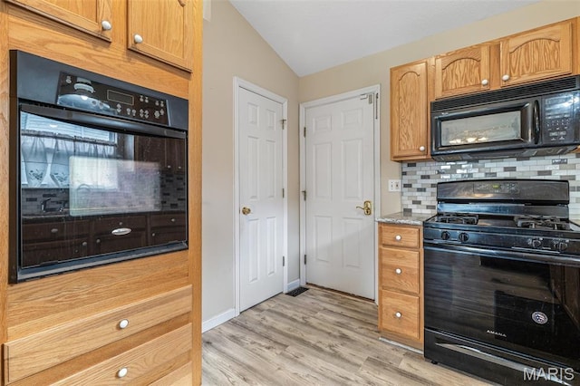1421 N Woods Dr, Festus, MO 63028 - kitchen with black appliances, decorative backsplash, lofted ceiling, and light wood-style floors