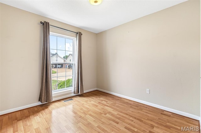 1421 N Woods Dr, Festus, MO 63028 - empty room featuring light wood-style floors and baseboards