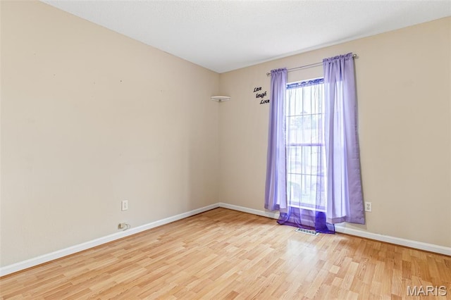 1421 N Woods Dr, Festus, MO 63028 - spare room with wood finished floors and baseboards
