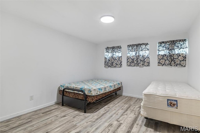 1421 N Woods Dr, Festus, MO 63028 - bedroom featuring wood finished floors and baseboards
