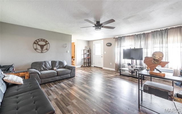 10771 Crest Rd, Dixon, MO 65459 - living area featuring a ceiling fan, a textured ceiling, baseboards, and wood finished floors