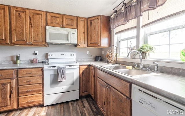 10771 Crest Rd, Dixon, MO 65459 - kitchen with white appliances, a sink, brown cabinetry, dark wood-style flooring, and light countertops