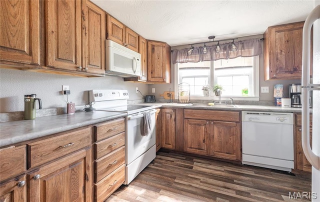 10771 Crest Rd, Dixon, MO 65459 - kitchen with white appliances, a sink, and brown cabinets