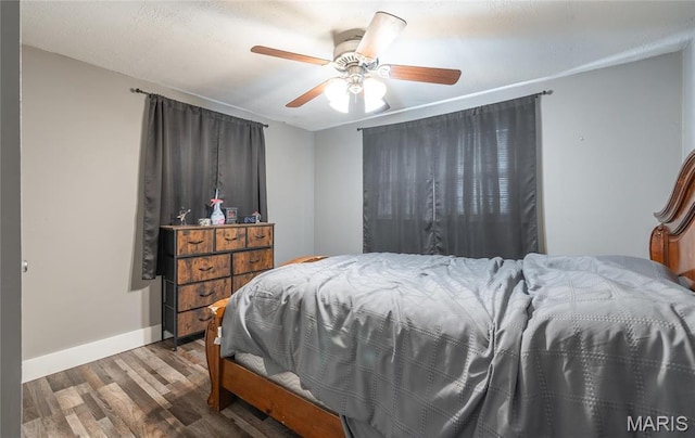 10771 Crest Rd, Dixon, MO 65459 - bedroom featuring wood finished floors, baseboards, and a ceiling fan
