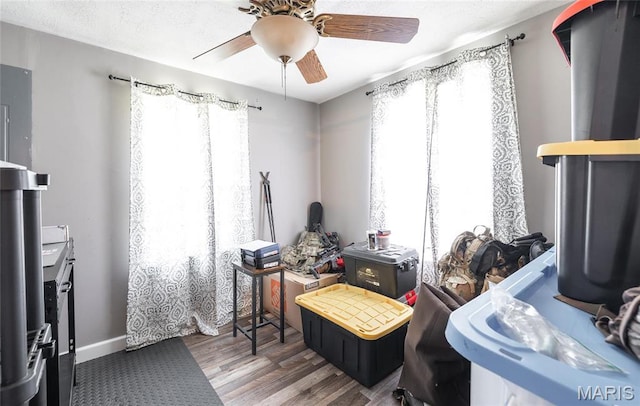 10771 Crest Rd, Dixon, MO 65459 - misc room featuring ceiling fan, wood finished floors, and baseboards