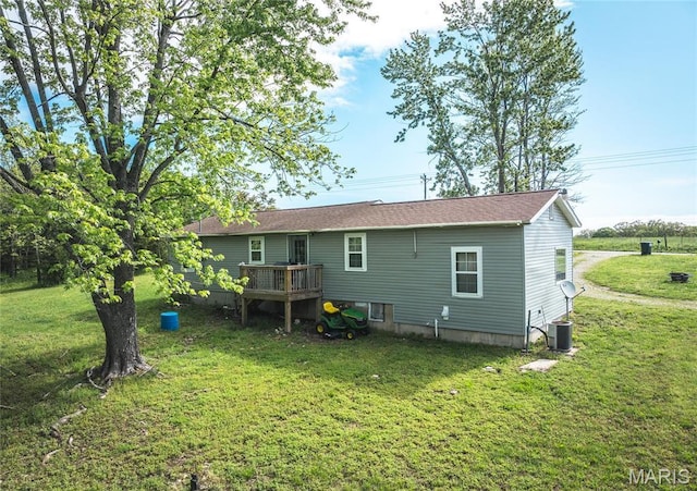 10771 Crest Rd, Dixon, MO 65459 - back of house with a wooden deck, a yard, and cooling unit